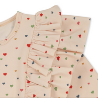 MANUCA FRILL ONESIE - MULTI HEARTS